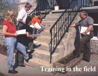 Paul Wilson instucting a class of students during a field inspection 